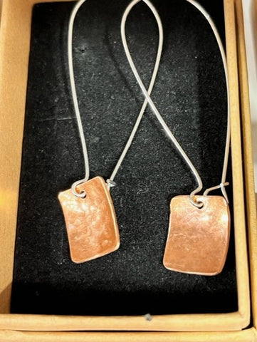 Handmade Cornish distressed copper rectangles with silver hoops.